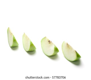 Sliced Green Apple On The White Background