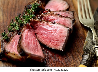 Sliced Grilled Lamb Steak On A Cutting Board