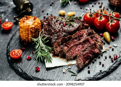 Sliced grilled meat steak Rib eye medium rare. Food recipe background. Close up.