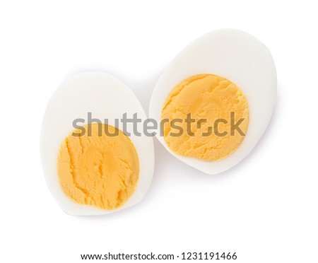Sliced hard boiled egg on white background