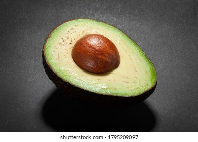 Sliced Hass Avocado On Black Background