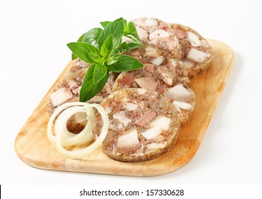 Sliced Head Cheese On A Cutting Board