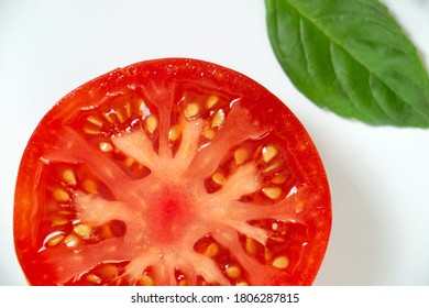 Sliced Heirloom Tomato On White Background