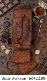 Sliced Homemade Chocolate Banana Pound Cake Loaf. Delicious Dessert. The Ingredients And The Pie On The Baking Sheet. Selective Focus, Top View