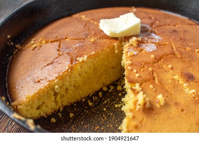 sliced homemade cornbread with melted butter