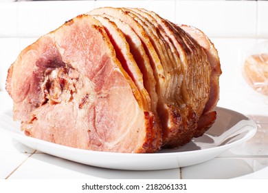 Sliced Honey Baked Ham On White Plate