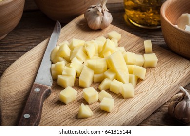 Sliced ingredients prepared to cook a tasty potato soup.