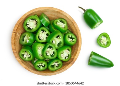 sliced jalapeno pepper in wooden bowl isolated on white background. Green chili pepper with clipping path. Top view. Flat lay