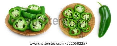 sliced jalapeno pepper in wooden bowl isolated on white background. Green chili pepper with full depth of field.