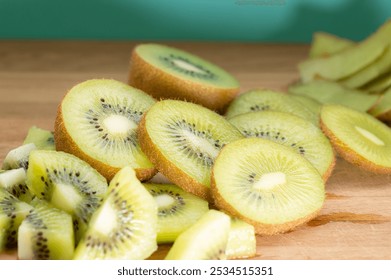 Sliced kiwis on a cutting board with a bright background. - Powered by Shutterstock