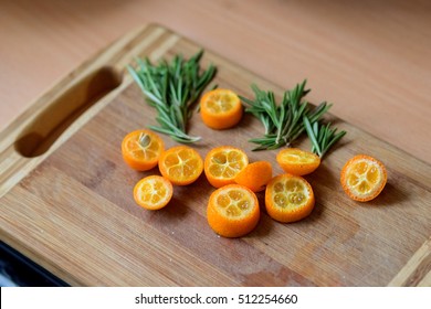 Sliced Kumquat, And Basil. The Beautiful Wooden Butcher