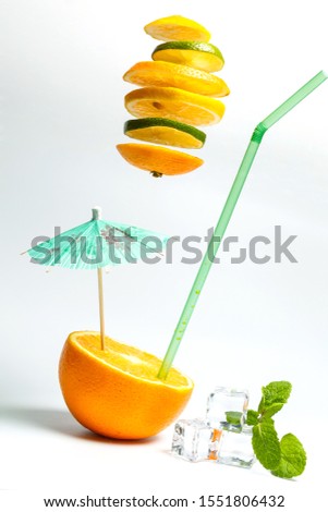Sliced lime and orange and half an orange on a white background