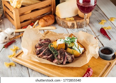 Sliced Lumbar Steak, Thin Sirloin With Baked Potatoes And Sour Cream, Horizontal