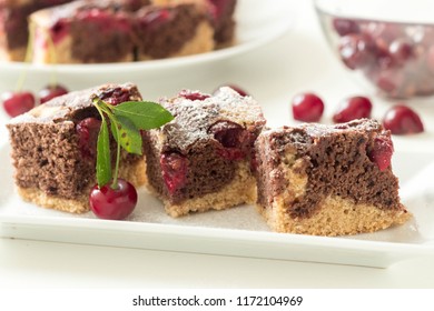 Sliced Marble Cake With Sour Cherry On White Plate.