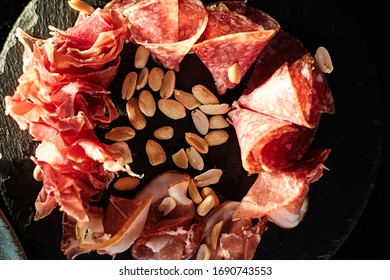 sliced meat and peanuts on a board - Shutterstock ID 1690743553