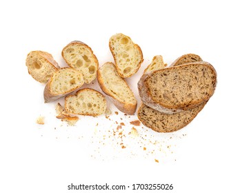 Sliced Multigrain rustic  bread isolated on a white background. Rye Bread with crusty loaves and crumbs. Top view. Flat lay. Bakery Food concept.
