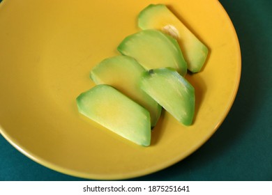 
Sliced ​​avacado On A Yellow Plate