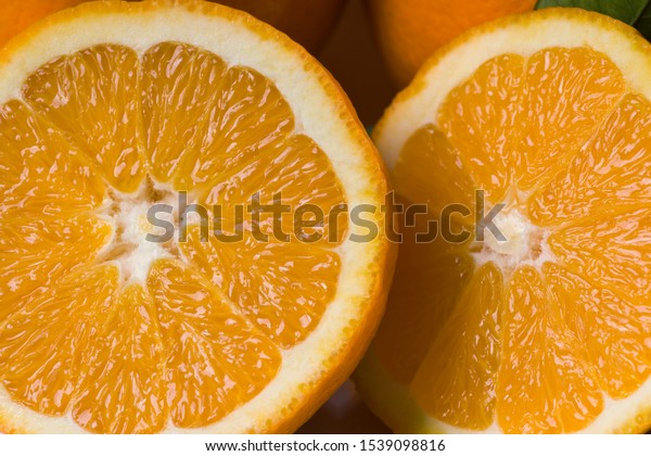 Sliced orange fruit to\
squeeze