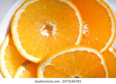 Sliced orange slices on a plate. Oranges in close-up. - Powered by Shutterstock