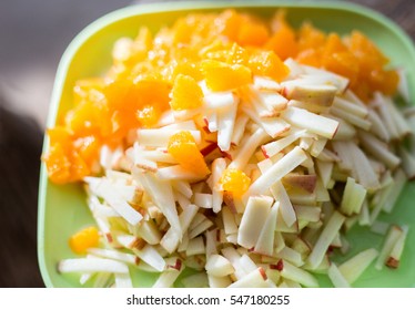 Sliced oranges and apples