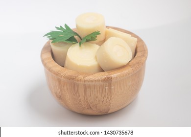 Sliced Palm Heart in a bowl on white background. Top view
