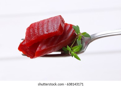 Sliced And Pickled Beetroot On Fork