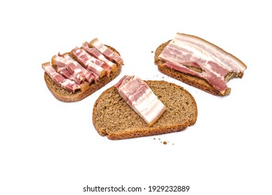 Sliced Pieces Of Salted Smoked Pork Lard With Rye Bread And Bread Crumbs Isolated On A White Background.