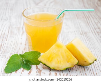 Sliced Pineapple With A Glass Of Pineapple Juice