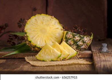 Sliced Pineapple On Wooden Table.