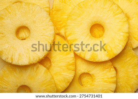 Sliced pineapple rings close up macro vibrant yellow background vitamins fruit
