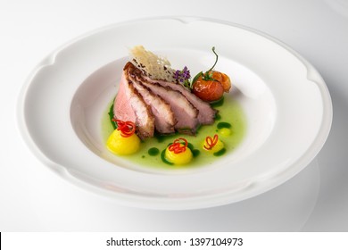 Sliced Pork Carving In Sauce With Mashed Potatoes And Grilled Vegetables. Banquet Festive Dishes. Fine Dining Restaurant Menu. White Background. 