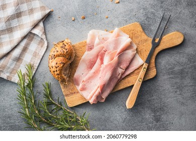 Sliced pork ham on cutting board. Top view. - Shutterstock ID 2060779298