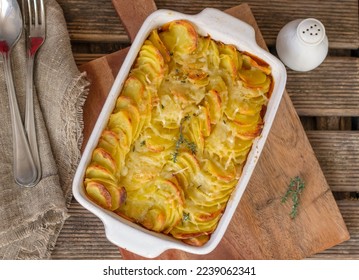 Sliced potatoes baked in cream and cheese Gratin dauphinois - Shutterstock ID 2239062341