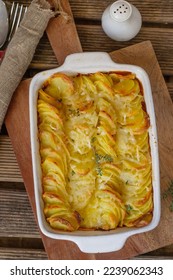 Sliced potatoes baked in cream and cheese Gratin dauphinois - Shutterstock ID 2239062343