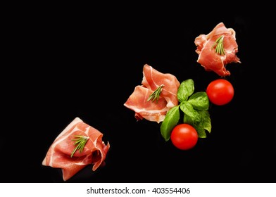 Sliced Prosciutto Isolated On Black Background