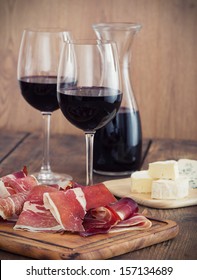 Sliced Prosciutto With Red Wine And Olives 