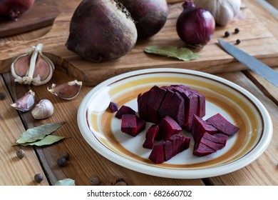 Sliced red beets on a plate, spices and other ingredients for beet kvass (fermented beets)