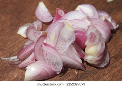 Sliced red onion on cutting board - Shutterstock ID 2252397893