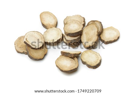 Sliced ​​of Red peony roots on white background. Chinese herbal medicine. Stock foto © 