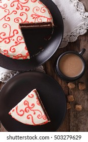 Sliced Red Velvet Cake Close-up And Coffee With Milk On The Table. Vertical View From Above
