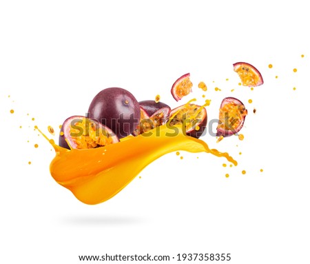 Sliced ripe passion fruits with splashes of fresh juice on a white background