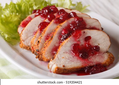 Sliced Roasted Turkey Breast With Cranberry Sauce On A Plate Close-up. Horizontal
