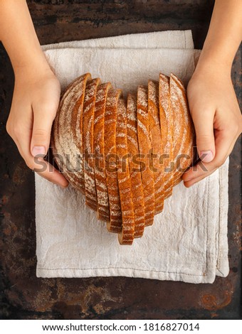 Similar – Image, Stock Photo baked round rye bread with sunflower seeds