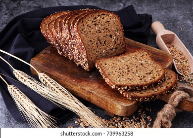 Sliced Rye Bread On Cutting Board. Whole Grain Rye Bread With Seeds