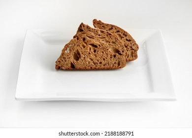 Sliced Rye Bread On Square Plate On White Background