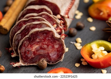 Sliced sausage of fresh veal meat, stewed beef sausage on the table - Shutterstock ID 2252391625