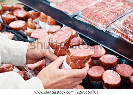 Similar – Delicious sausages on a supermarket fridge shelf