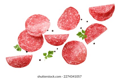Sliced sausage with parsley leaves and peppercorns are flying on a white background. Isolated
