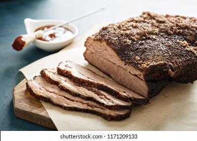 Sliced slowly cooked brisket with bbq sauce