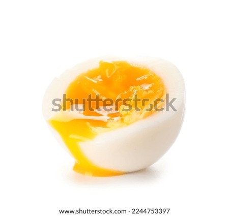 Sliced soft boiled egg on white background